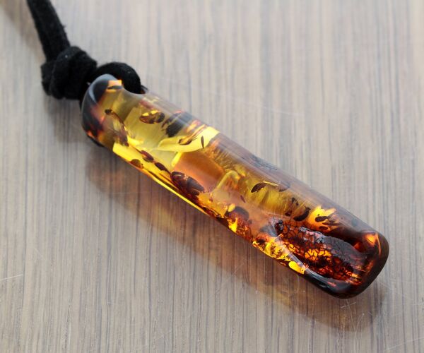 Natural Amber Hole Pendant w Leather Cord
