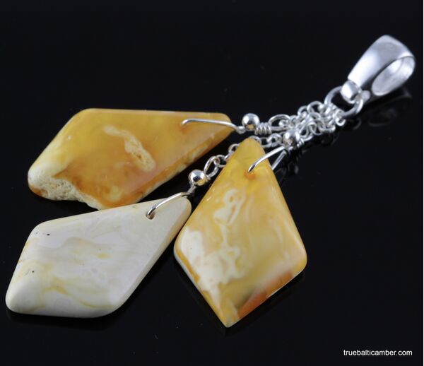 Carved Baltic amber pieces pendant